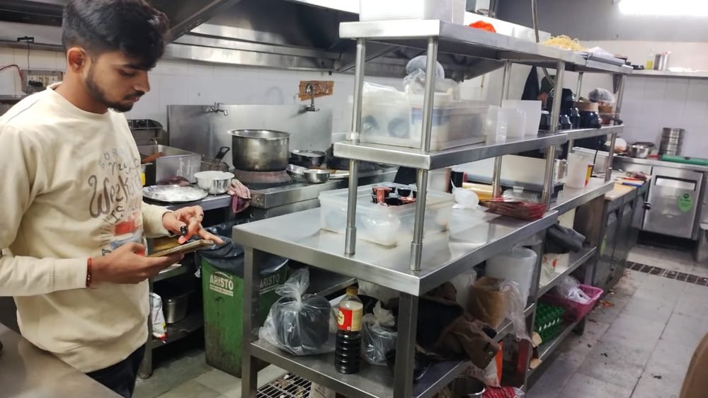 Chefs preparing food live in a Blue Wings cloud kitchen